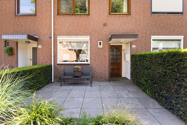 Foto - Te koop: Goed onderhouden tussenwoning in rustige woonwijk!